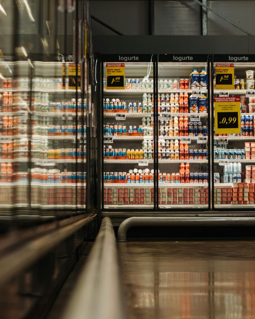 How Many Solar Panels Do I Need to Run a Refrigerator Off-Grid? A well-lit supermarket aisle showcasing a variety of yogurt products in a refrigerated display.