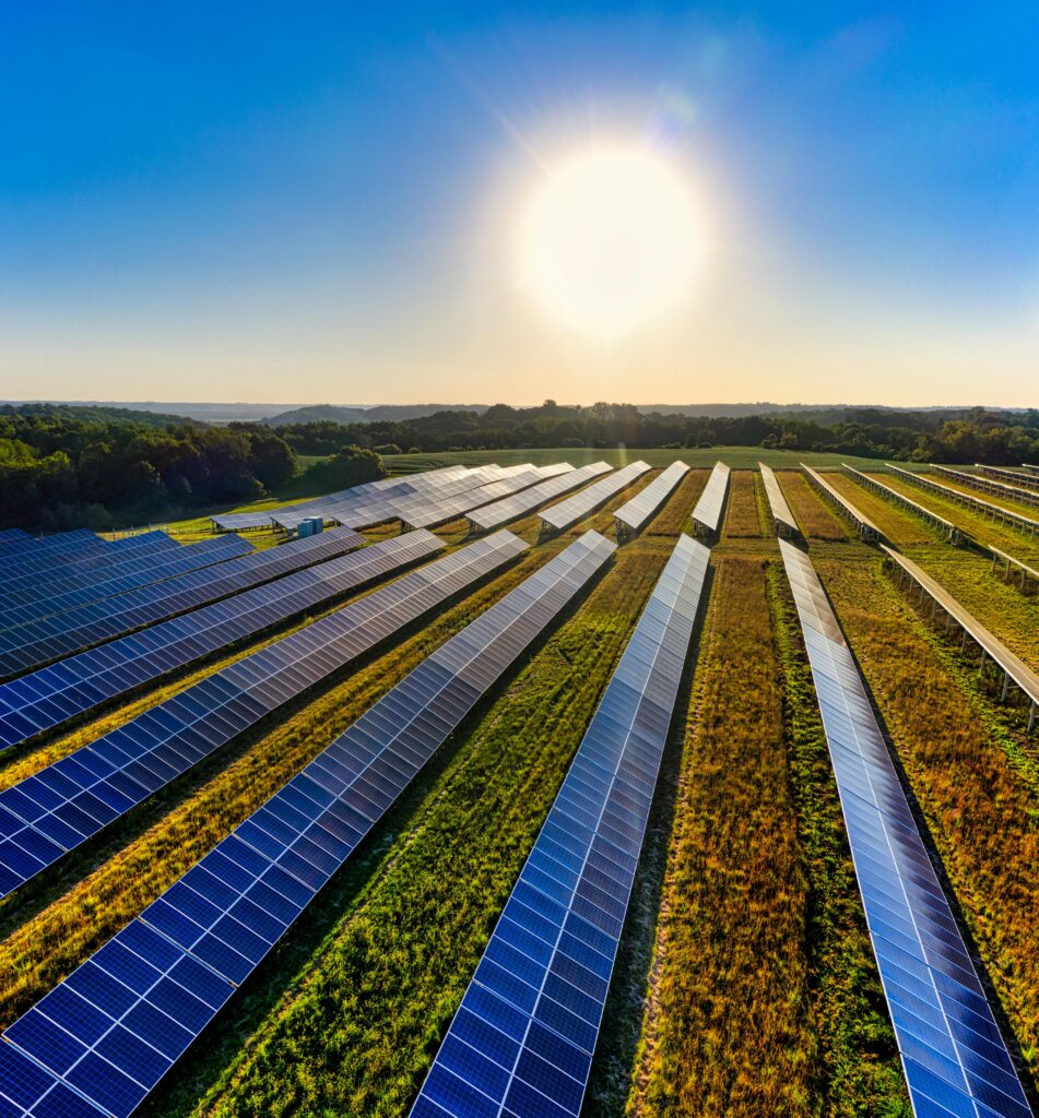 Aerial view of a solar farm in Red Wing, MN, with solar panels harnessing the sun's energy.